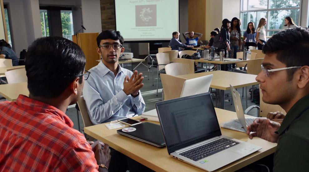 Engineering Management students at a table.